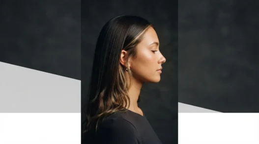 Woman with long Y2K-style hair featuring face-framing highlighted pieces and loose wave ends in amber studio light